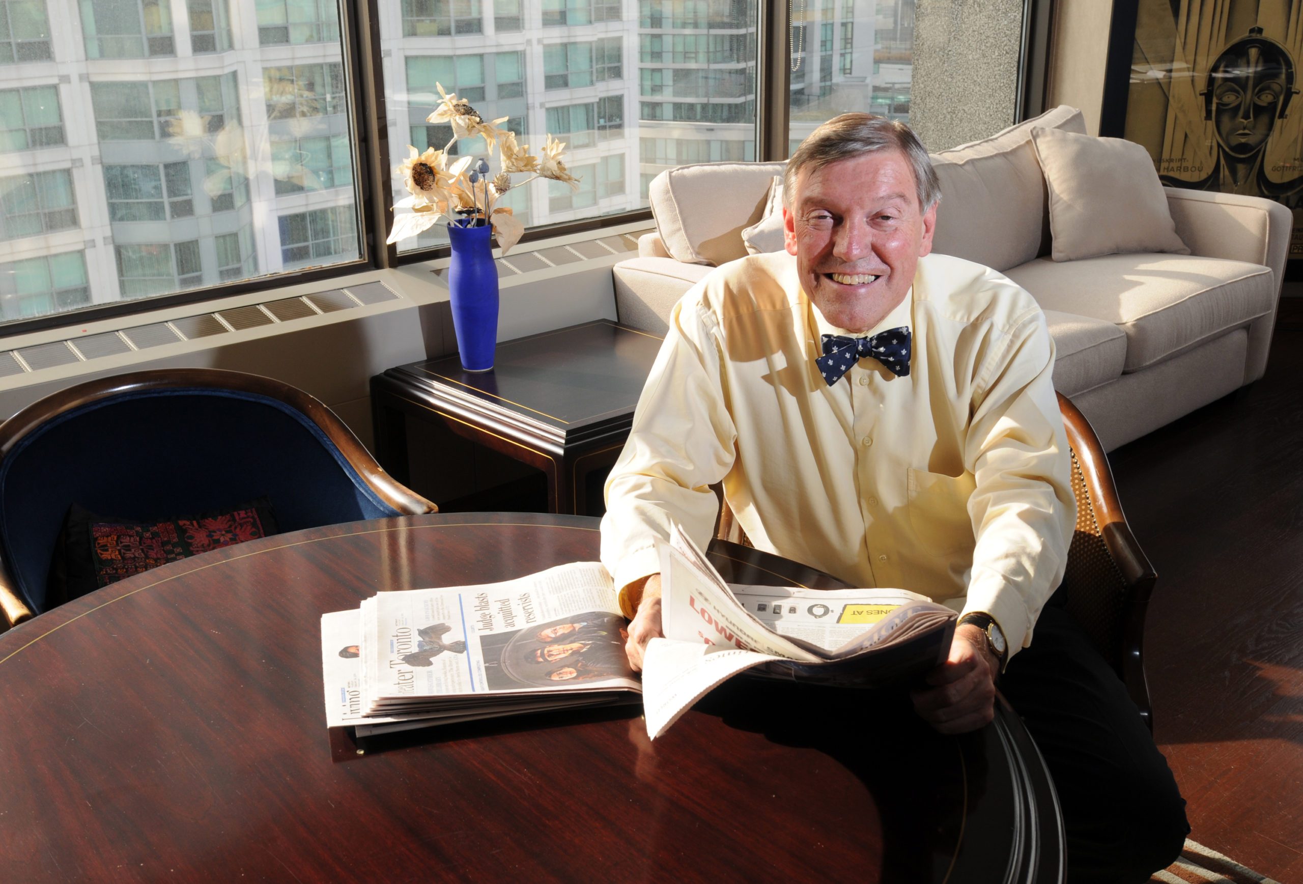 Man in a yellow shirt and a blue bowtie.